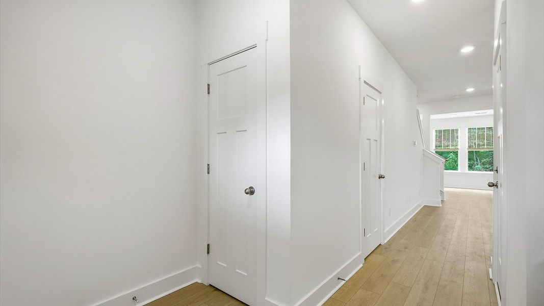 Notable hardwood flooring enhances the elegance of this accomplished entryway by DRB Homes Notable hardwood flooring enhances the elegance of this accomplished entryway by DRB Homes