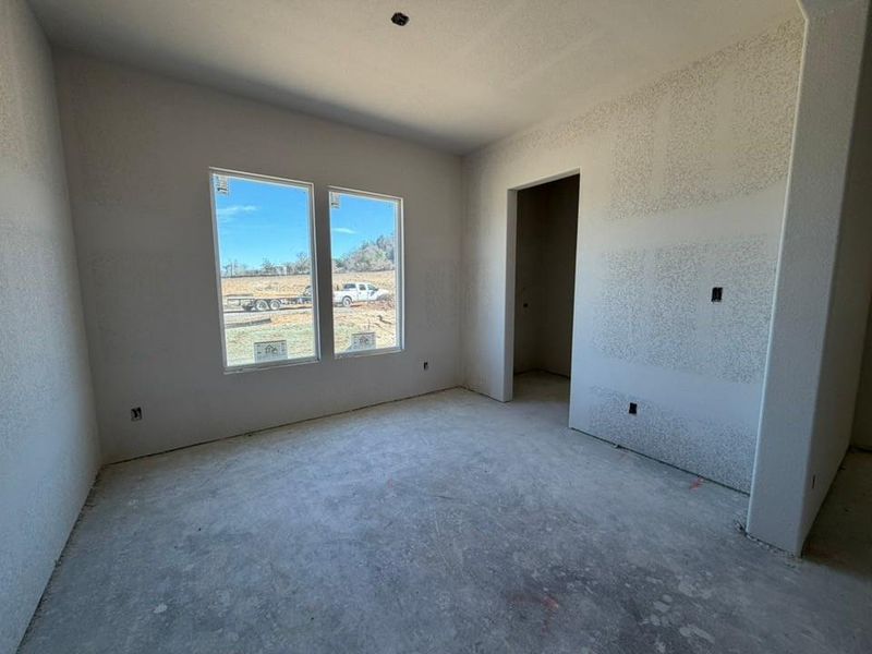 Spare room with a textured wall