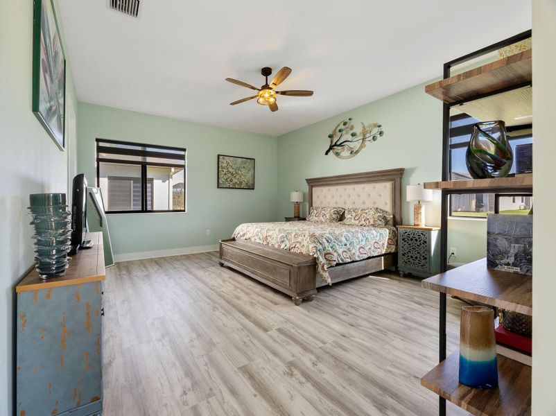 Bedroom featuring a ceiling fan and light wood-style flooring