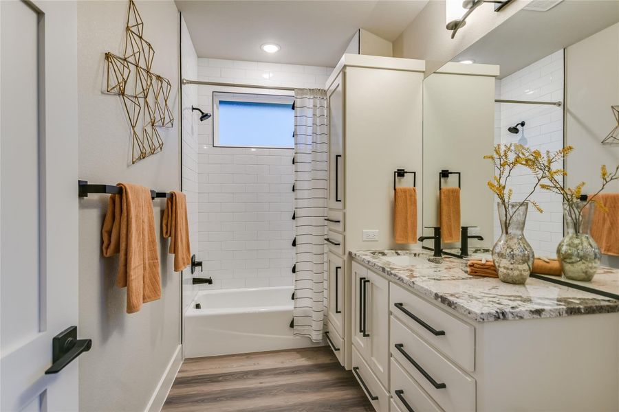 Bathroom featuring shower / bathtub combination Bathroom featuring shower / bathtub combination