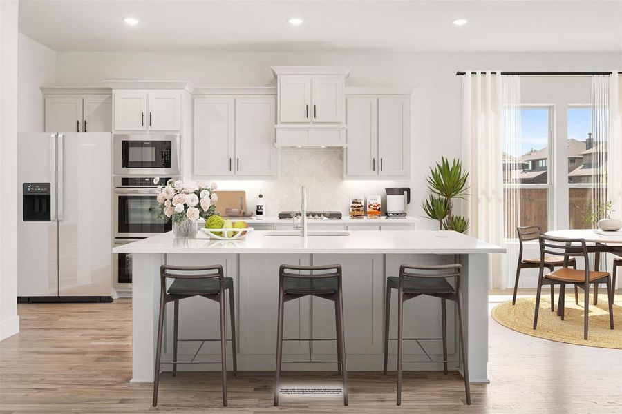 White kitchen with large island, three bar stools, stainless appliances, and adjacent dining area with hardwood floors