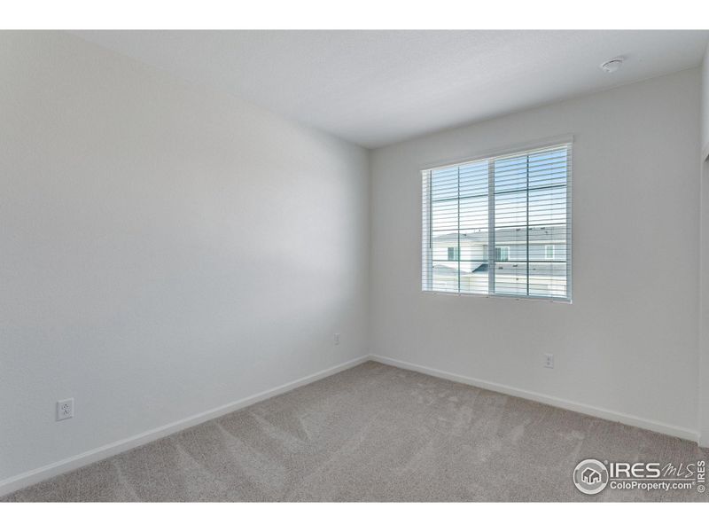 Spacious, unfurnished interior of a new home in Westside Crossing Townhomes, Berthoud (Image 25).