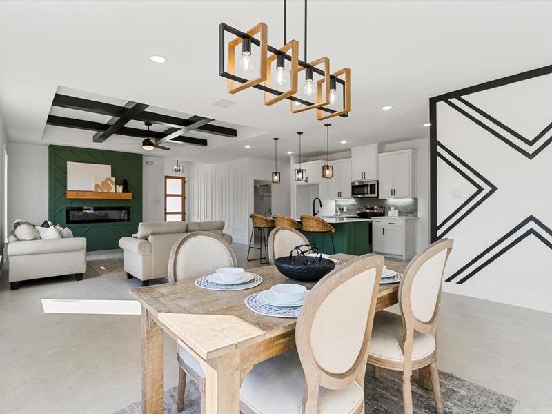 Dining area with coffered ceiling, recessed lighting, a ceiling fan, and beamed ceiling