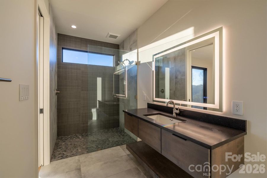 Ensuite baths for each lower level bedroom
