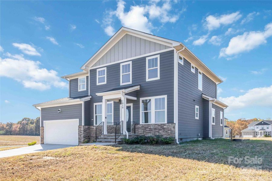 Front exterior of a new home in , Monroe, NC, highlighting curb appeal (Image 22).