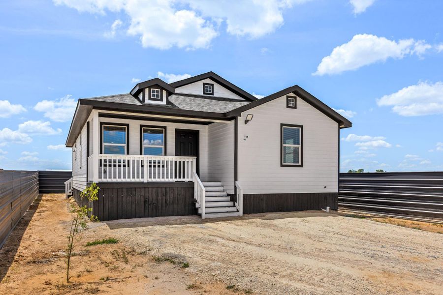 Front exterior of a new home in , Cleveland, TX, highlighting curb appeal (Image 2). Front exterior of a new home in , Cleveland, TX, highlighting curb appeal (Image 2).