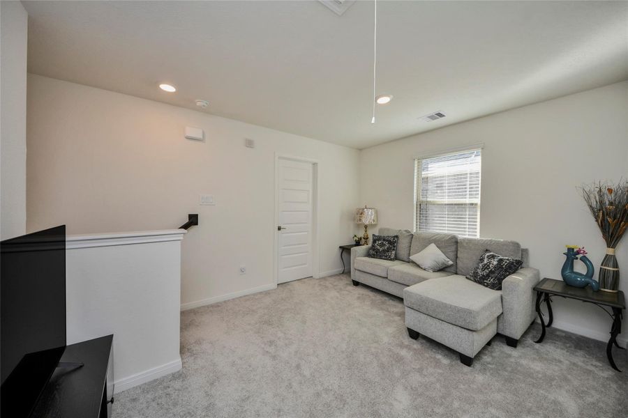 Furnished interior view inside a new home in Sunterra North, Katy (Image 18).