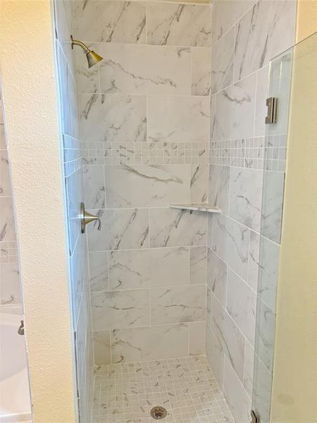 Full bath featuring a stall shower