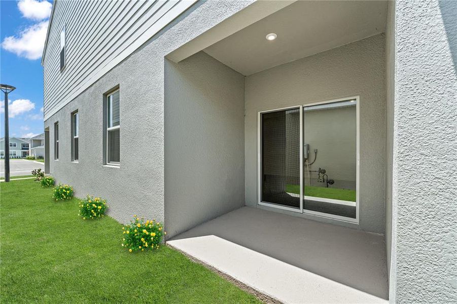 Exterior details and patio area of a home in Spring Walk at the Junction, Debary (Image 3).