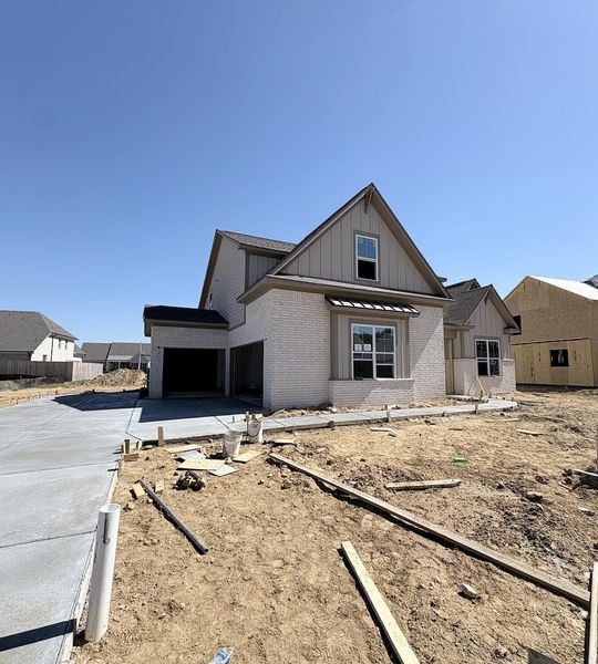 Brick and siding exterior with a two-car garage