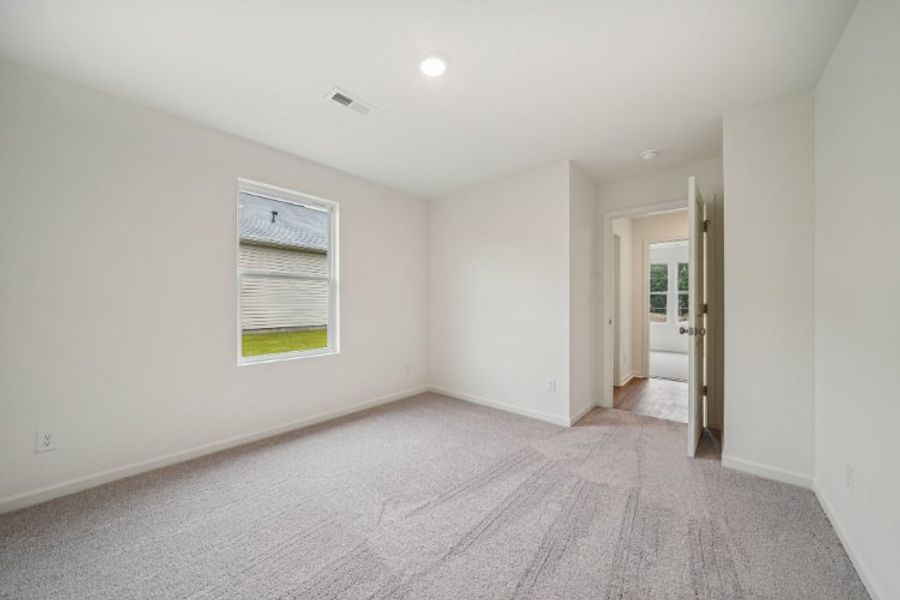 A hallway with white walls. A hallway with white walls.