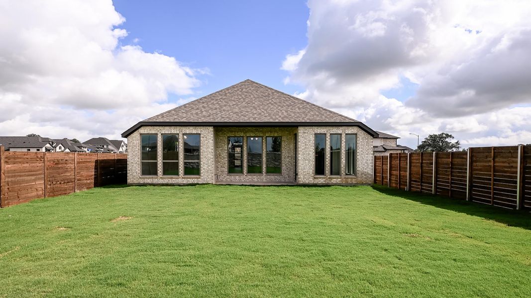 Exterior details and patio area of a home in Juniper Springs, Lockhart (Image 2).