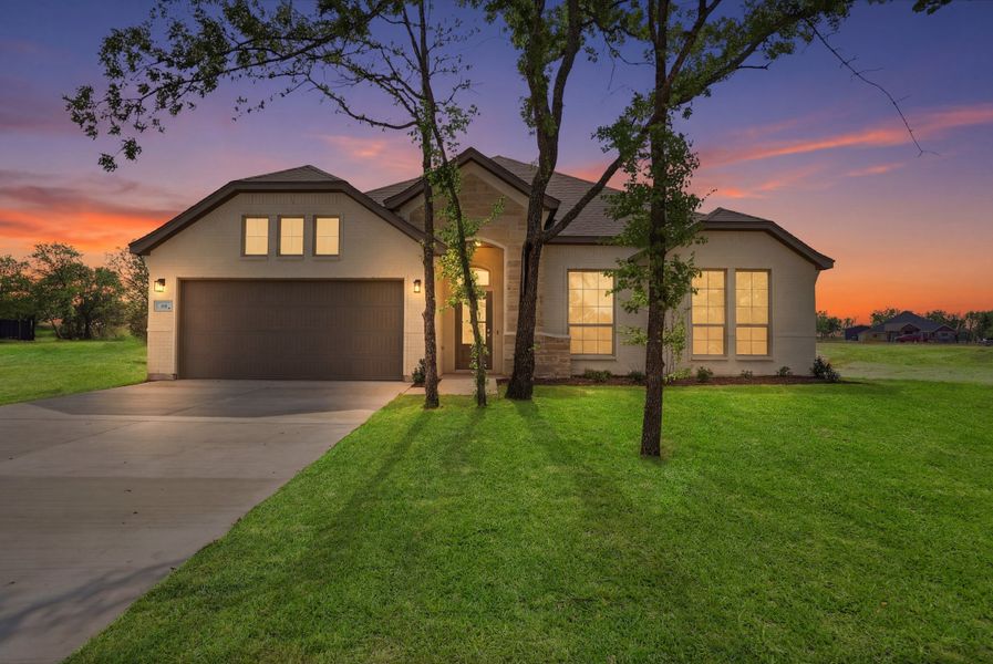 Front exterior of a new home in Arbor Oaks, Boyd, TX, highlighting curb appeal (Image 28). Front exterior of a new home in Arbor Oaks, Boyd, TX, highlighting curb appeal (Image 28).