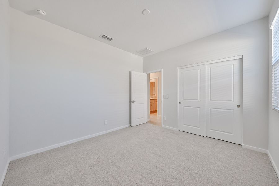 A hallway with white doors. A hallway with white doors.