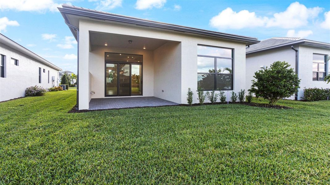 Exterior details and patio area of a home in Cresswind Palm Beach at Westlake, The Acreage (Image 3). Exterior details and patio area of a home in Cresswind Palm Beach at Westlake, The Acreage (Image 3).
