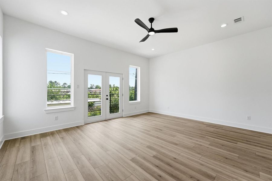 See it from every angle and it just keeps getting better. This view of the living room highlights the generous square footage, glass doors leading out to the private balcony, recessed lighting, and seamless flow to the rest of the second floor that makes this space as functional as it is beautiful. See it from every angle and it just keeps getting better. This view of the living room highlights the generous square footage, glass doors leading out to the private balcony, recessed lighting, and seamless flow to the rest of the second floor that makes this space as functional as it is beautiful.