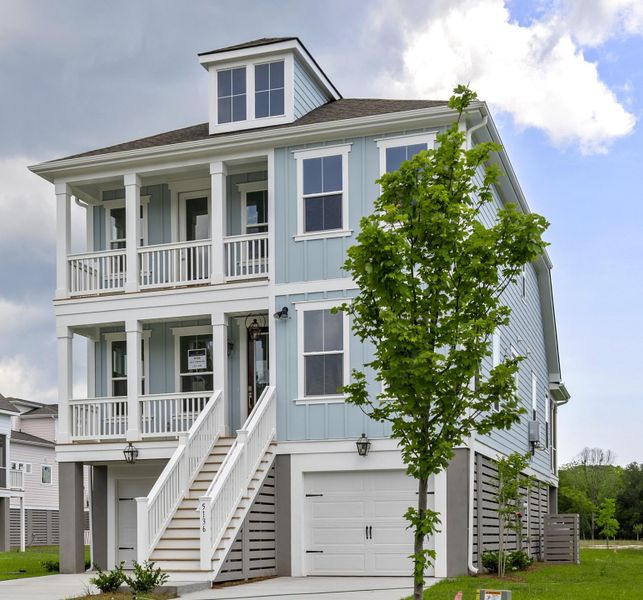 Front exterior of a new home in Miller's Crossing, Johns Island, SC, highlighting curb appeal (Image 1). Front exterior of a new home in Miller's Crossing, Johns Island, SC, highlighting curb appeal (Image 1).