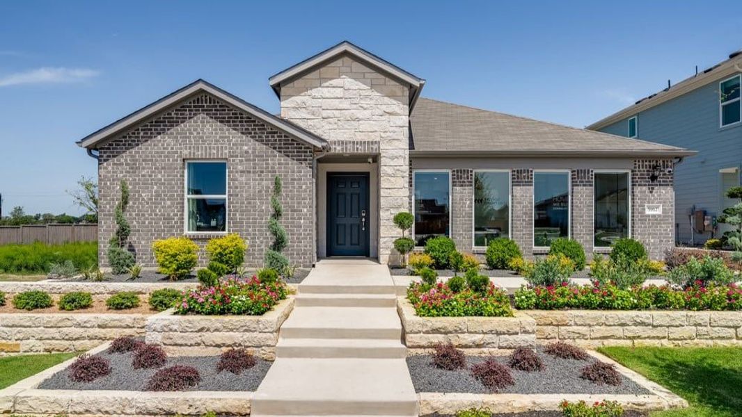 Representative exterior photo of a completed home built from the Finch by Taylor Morrison in Longview 50s, Del Valle, TX (Image 1).