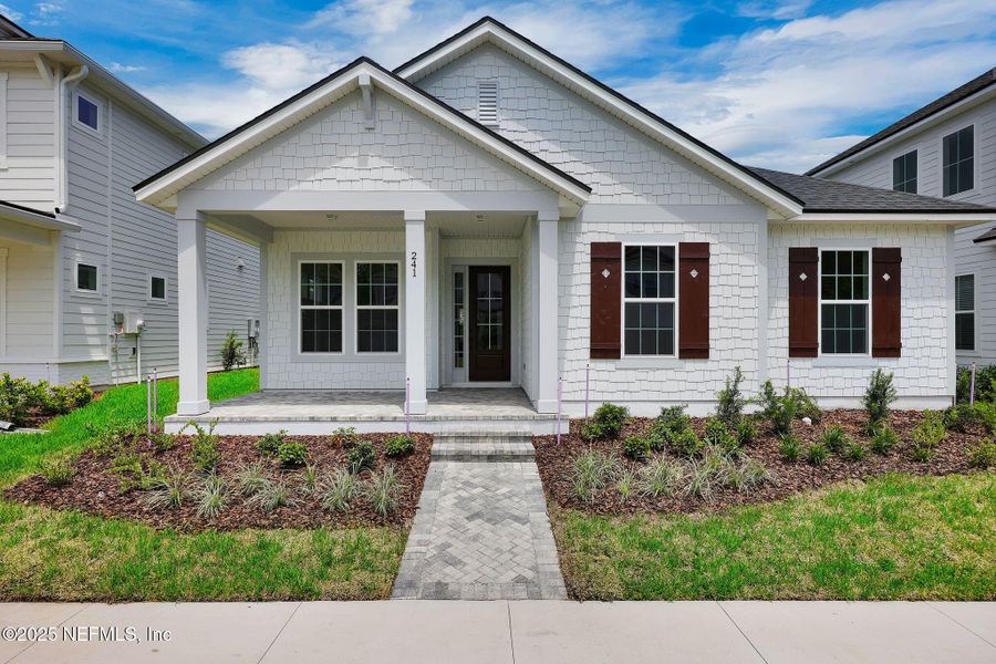 Front exterior of a new home in Seabrook Village at Seabrook, Ponte Vedra, FL, highlighting curb appeal (Image 18).