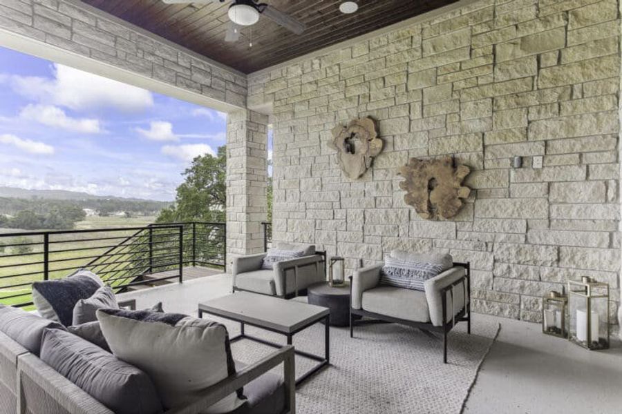 Covered outdoor living area in Ashlyn home at Belle Oaks, Bulverde TX