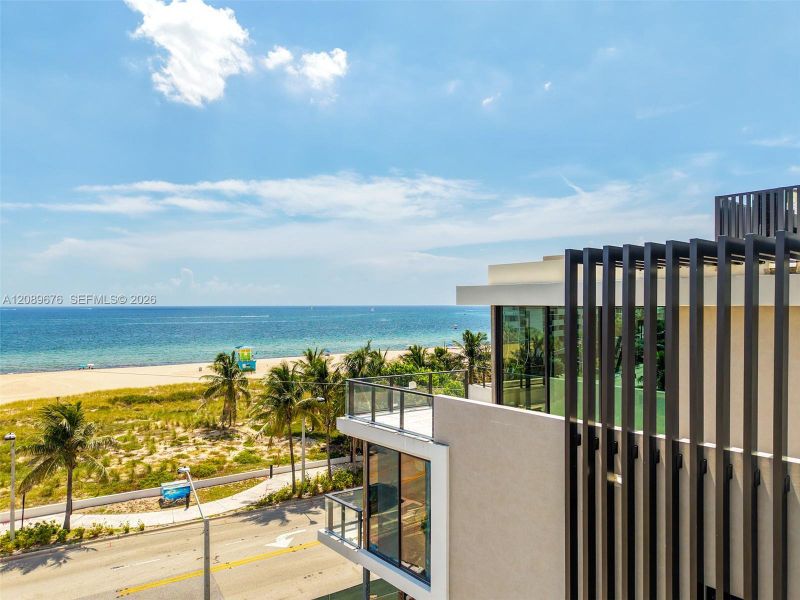 Louvered facade with the beach beyond. Louvered facade with the beach beyond.