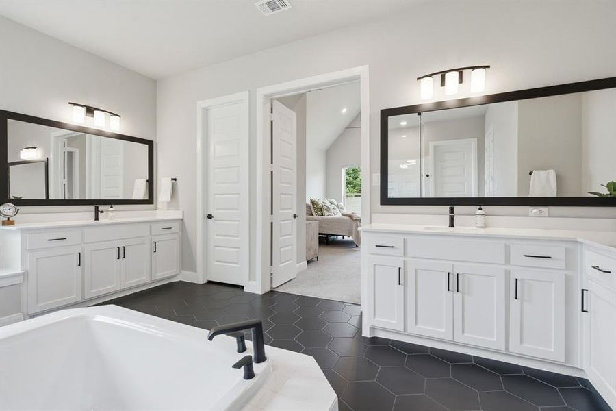 The Spaciousness Of The Owner's Bath Is Evident Here.  You'll Appreciate The Separate Vanities With Abundant Countertop And Storage Space Plus A Linen Closet.