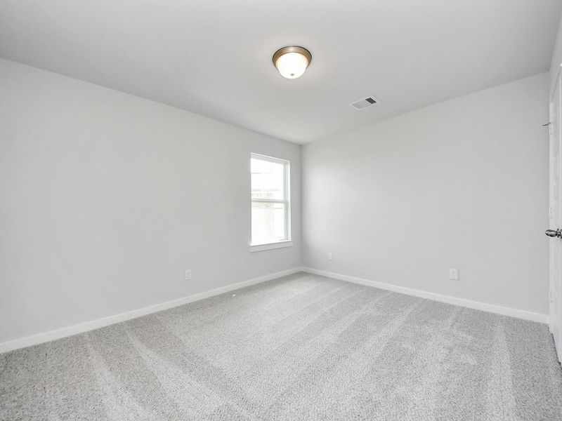 Spacious, unfurnished interior of a new home in Sunterra, Katy (Image 30).