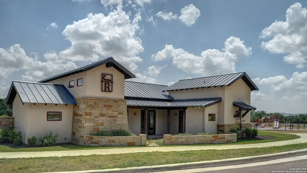 Front exterior of a new home in Johnson Ranch Half Acre, Bulverde, TX, highlighting curb appeal (Image 5).