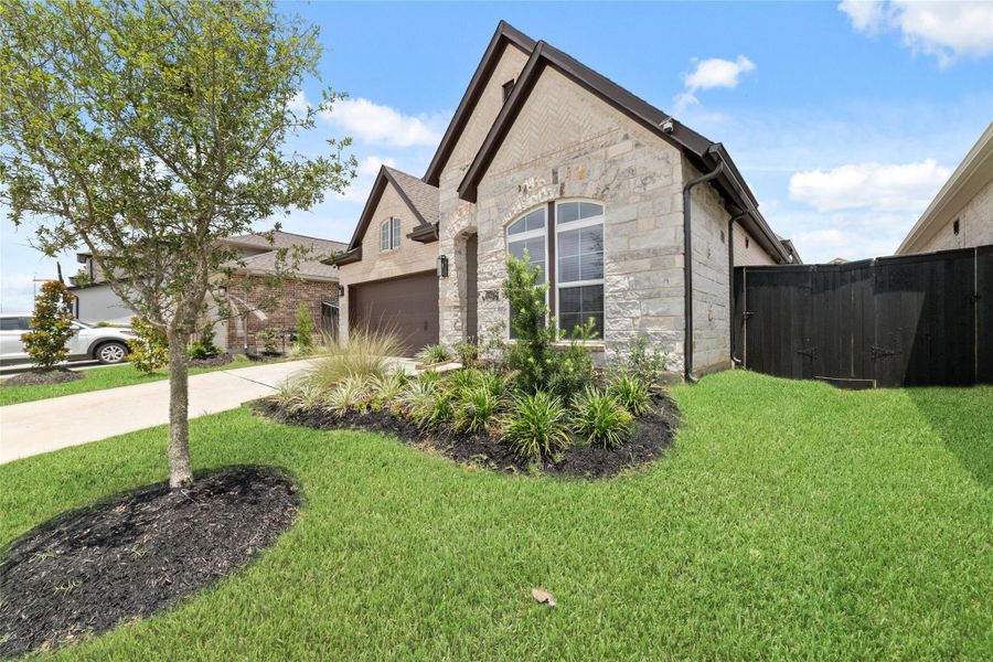 Front exterior of a new home in Harvest Green - Reserve Collection, Richmond, TX, highlighting curb appeal (Image 20).