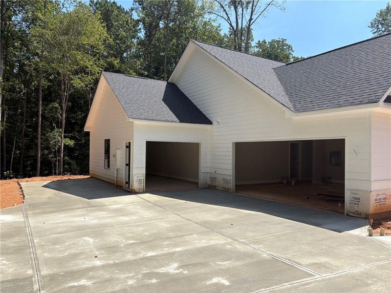 Front exterior of a new home in , Dallas, GA, highlighting curb appeal (Image 21).