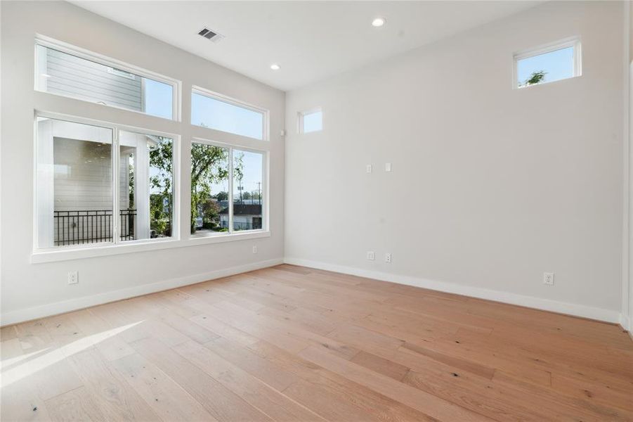 The living room not only boast high ceiling but plenty of options for natural light.