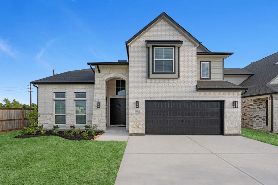 Front exterior of a new home in Morton Creek Ranch, Katy, TX, highlighting curb appeal (Image 2). Front exterior of a new home in Morton Creek Ranch, Katy, TX, highlighting curb appeal (Image 2).