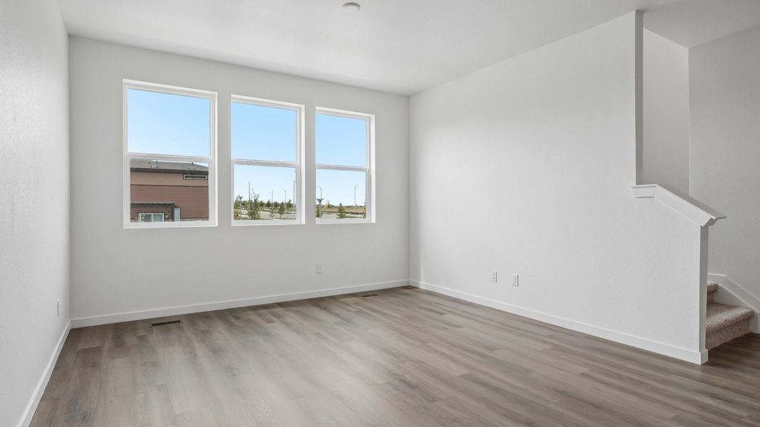 Living area with open layout and natural light. Living area with open layout and natural light.