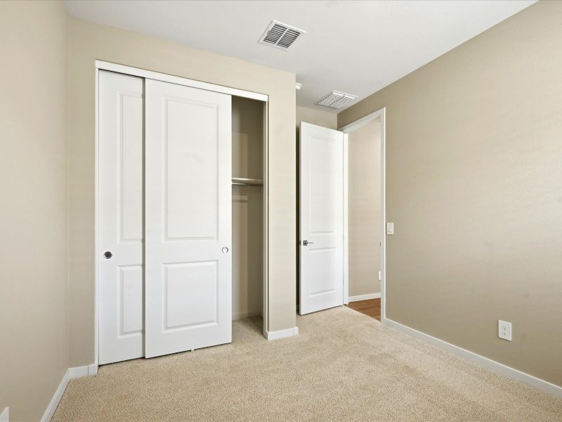 Spacious, unfurnished interior of a new home in White Tank Foothills Reserve Series, Waddell (Image 21).