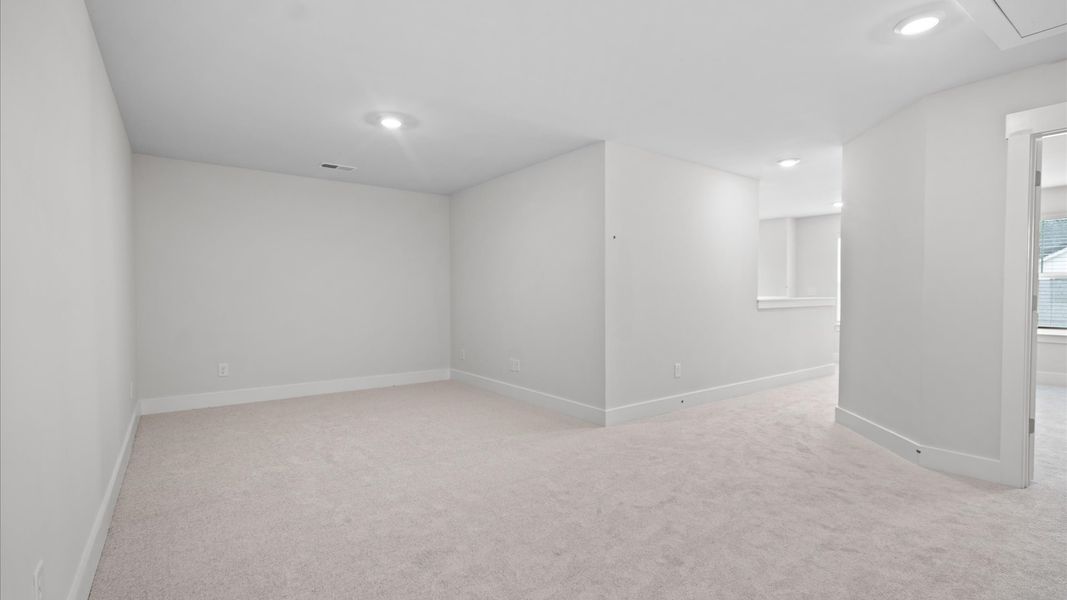 First-class secondary bedroom with carpeted flooring and generous closet space at Silo Ridge by DRB Homes in Anderson, SC
