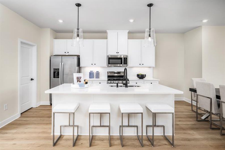 Representative furnished interior of a home built from the Schuman by Ryan Homes in Stowe Branch Townhomes, Charlotte (Image 3).