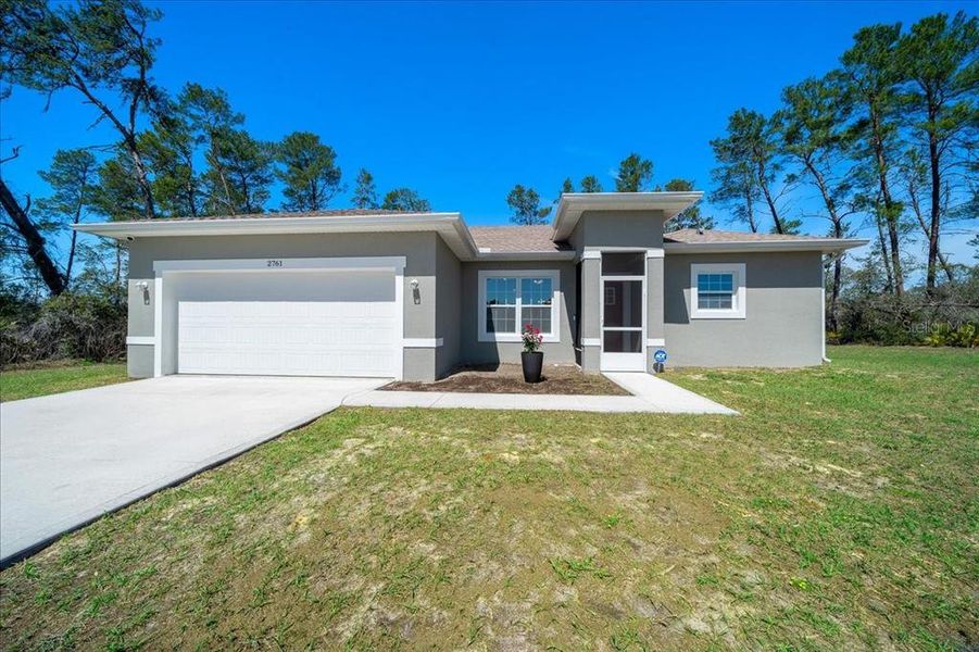 Front exterior of a new home in , Ocala, FL, highlighting curb appeal (Image 24).