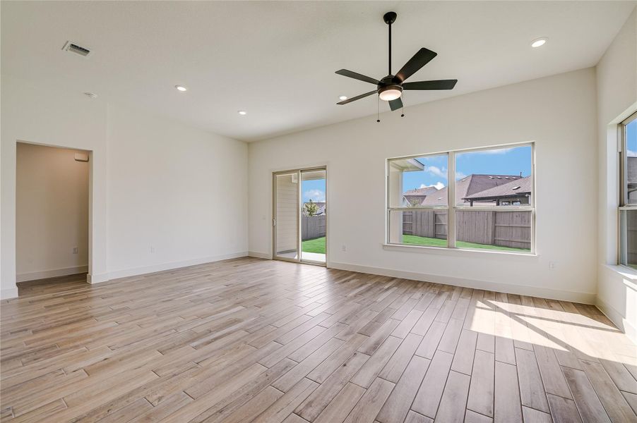 Empty room with recessed lighting, light wood-style floors, and ceiling fan