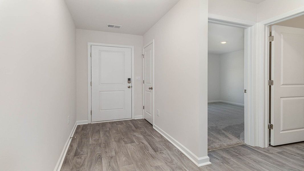 Representative unfurnished interior of a home built from the CALI by D.R. Horton in Heritage Crossing, Conway (Image 25).