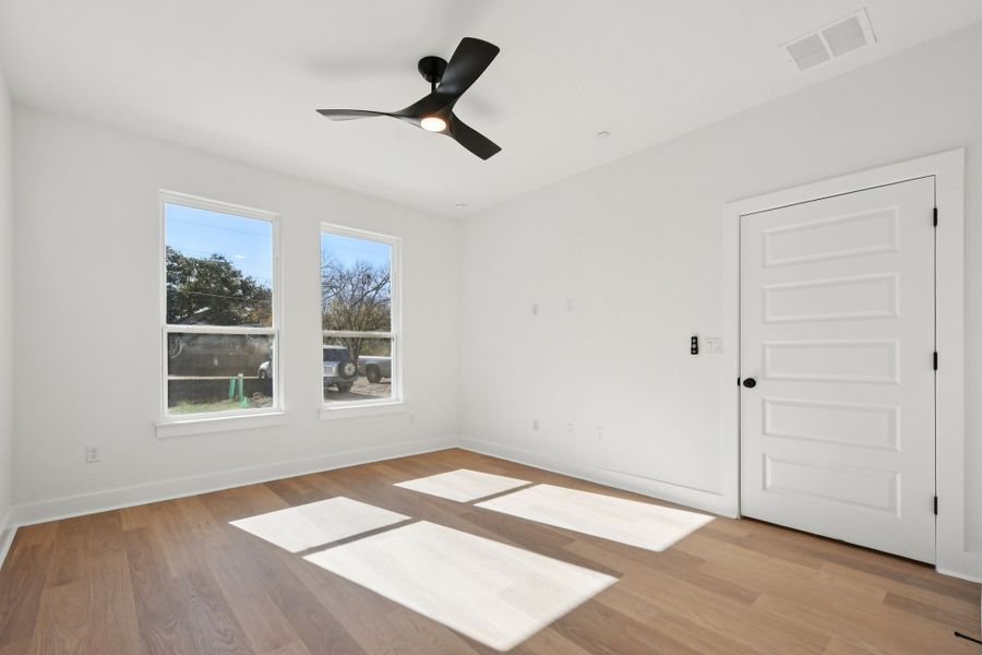 Spacious, unfurnished interior of a new home in Koenig Townhomes, Austin (Image 27).