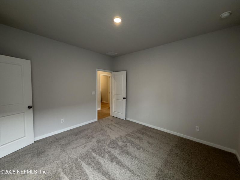 Spacious, unfurnished interior of a new home in The Magnolia Series at Reserve East, Flagler Beach (Image 28).