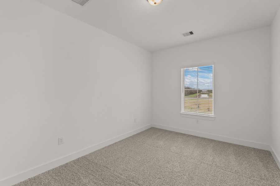 Representative unfurnished interior of a home built from the Sorenstam by Chesmar Homes in Riceland Alley Loads, Mont Belvieu (Image 76).