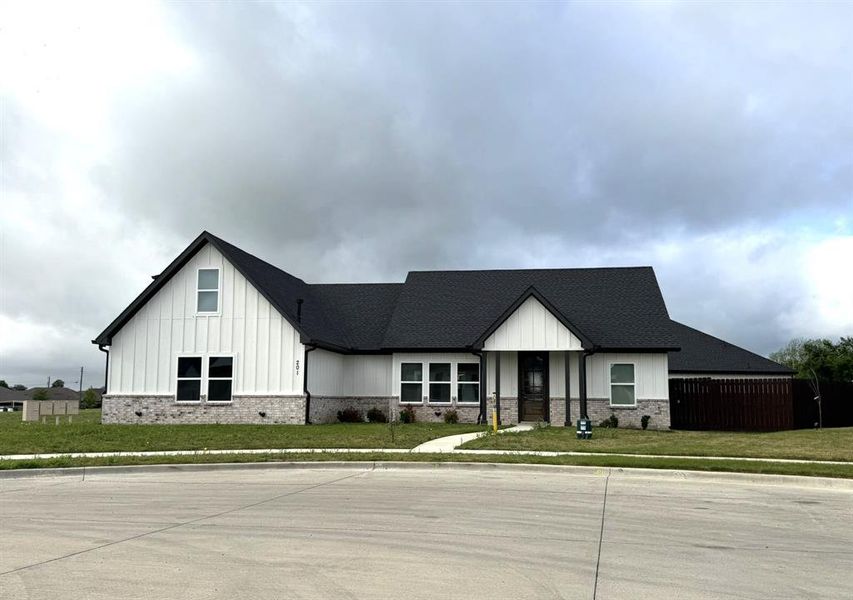 Front exterior of a new home in , Godley, TX, highlighting curb appeal (Image 2). Front exterior of a new home in , Godley, TX, highlighting curb appeal (Image 2).