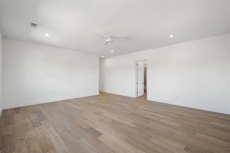 Unfurnished room featuring light wood finished floors, recessed lighting, and a ceiling fan Unfurnished room featuring light wood finished floors, recessed lighting, and a ceiling fan