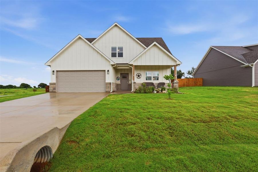 Front exterior of a new home in , Tolar, TX, highlighting curb appeal (Image 23).