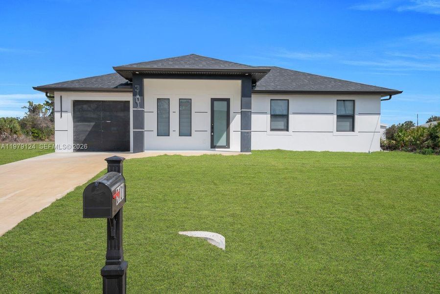 Front exterior of a new home in , Lehigh Acres, FL, highlighting curb appeal (Image 23).