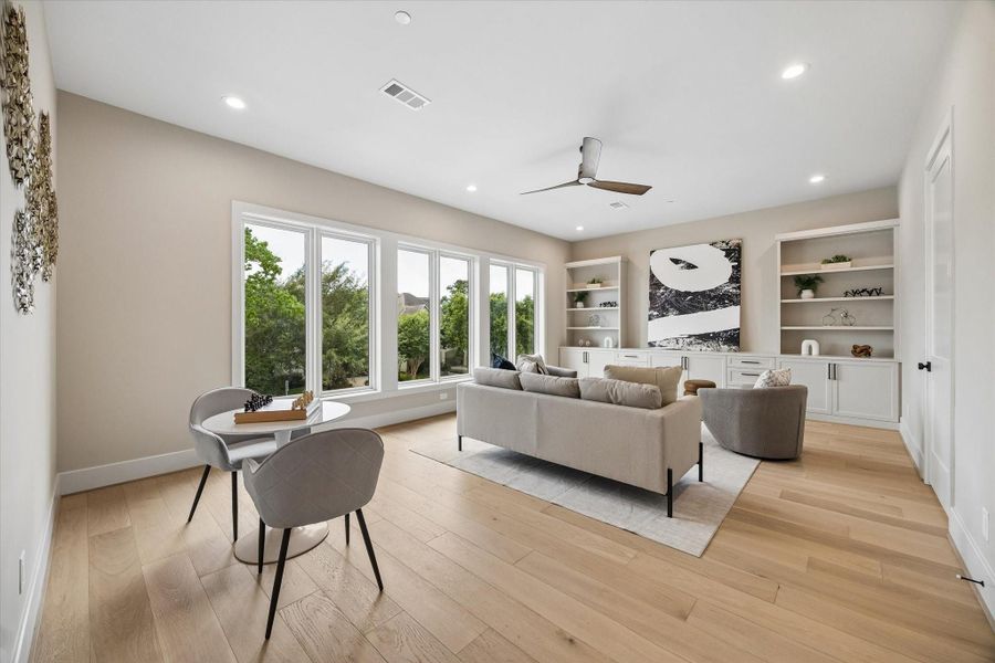 The second-floor game room adds flexible living space with built-in storage, easy access to a full bath, and a nearby guest bedroom. The second-floor game room adds flexible living space with built-in storage, easy access to a full bath, and a nearby guest bedroom.