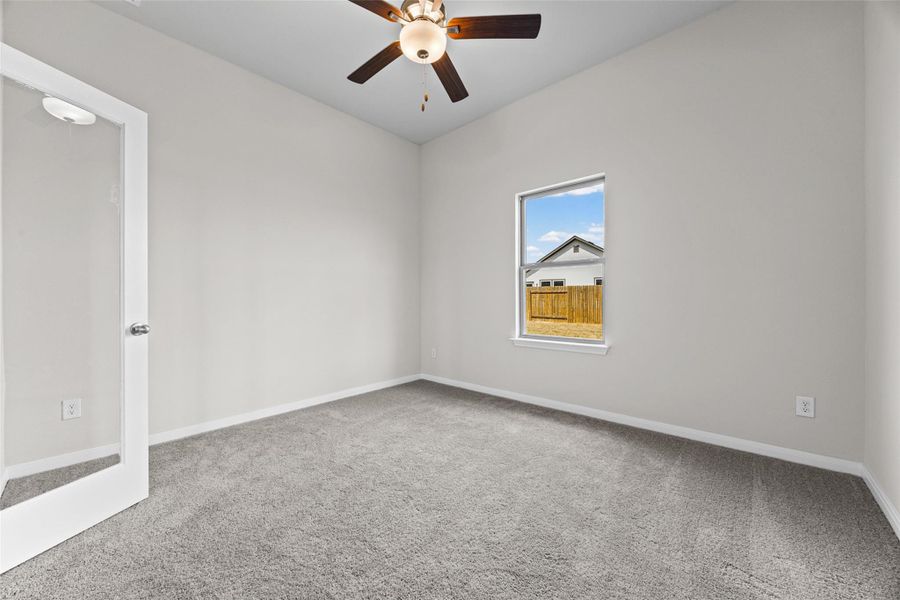 High ceilings and neutral carpet define this versatile space, complete with a glass door. High ceilings and neutral carpet define this versatile space, complete with a glass door.