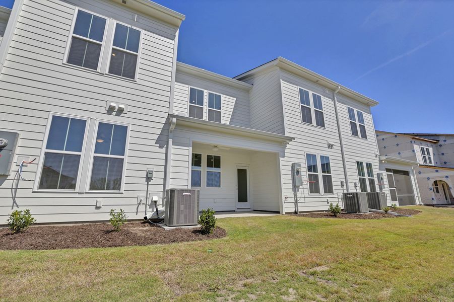 Exterior details and patio area of a home in Grand Park, Leland (Image 3).