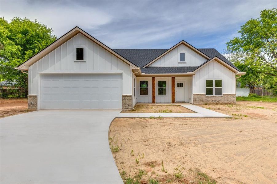 Front exterior of a new home in , Granbury, TX, highlighting curb appeal (Image 18).